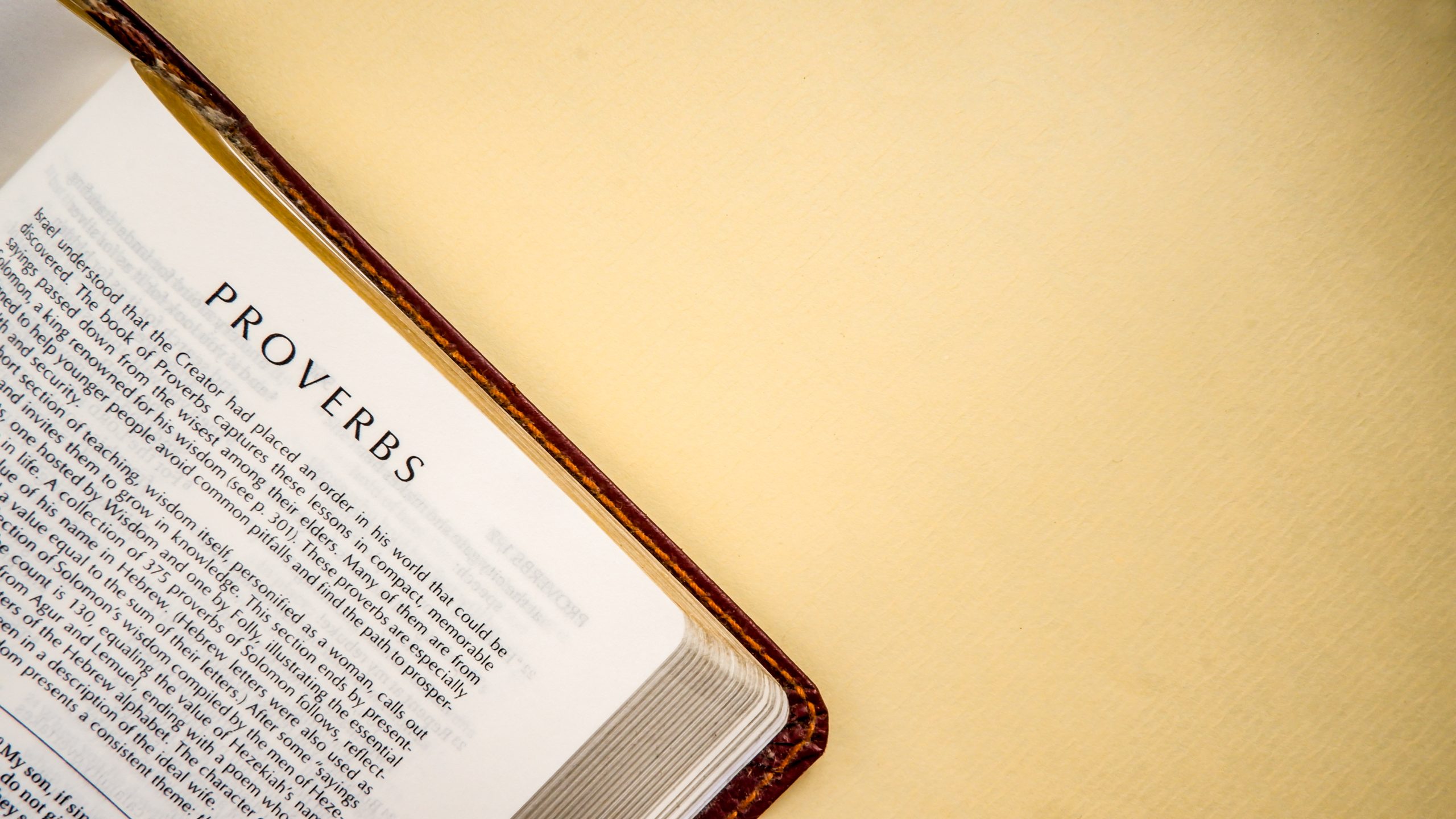 Open pages of the bible background (book of Proverbs)